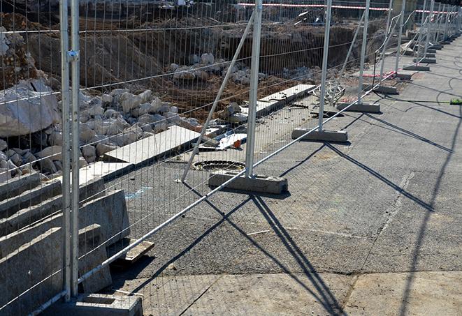 a workers' break area defined by temporary fence panels